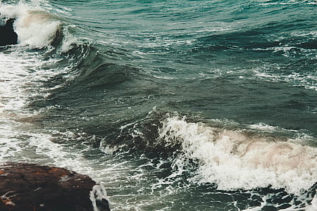 seawaves during daytime thumbnail