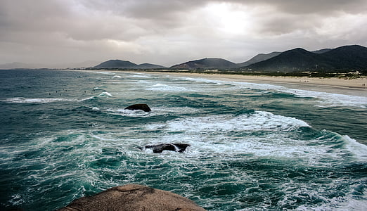 sea waves during cloudy skies thumbnail