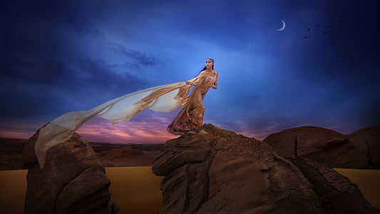 woman standing hill during nighttime thumbnail