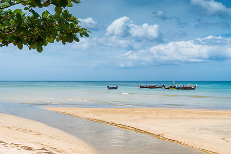 brown boat on blue sea during daytime thumbnail