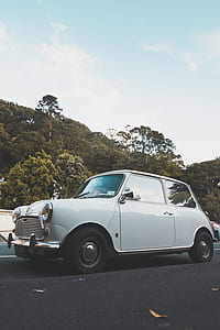 classic white 3-door hatchback on road at daytime thumbnail