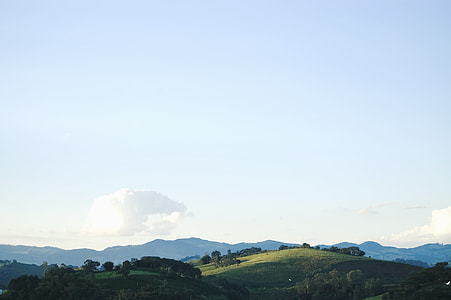 green grass mountain during daytime thumbnail