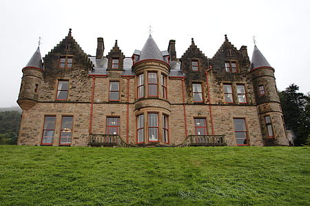 brown and grey concrete castle in front of grass field thumbnail
