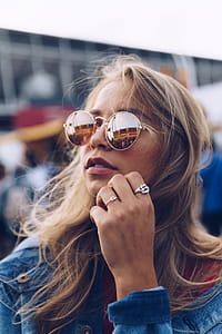 Young Woman In Sunglasses With Rings Photo thumbnail