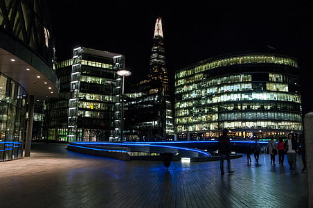 people walking near building at night time thumbnail