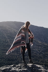 woman wearing black pants on mountain summit thumbnail
