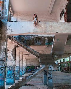 woman sitting in abandoned building thumbnail