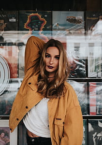 woman wearing brown button-up jacket thumbnail