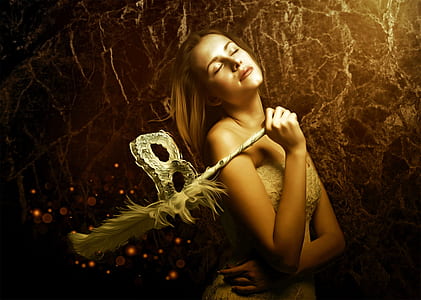 woman holding masquerade mask and wearing tube dress thumbnail