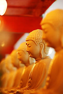 white ceramic buddha in macroshot photography thumbnail
