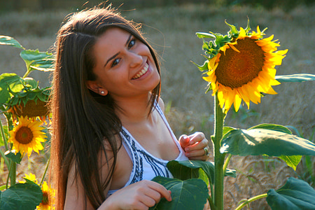 woman facing sunflower thumbnail