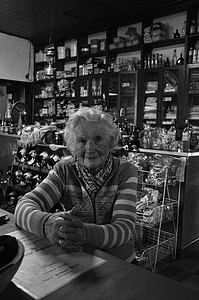 woman sitting beside table thumbnail