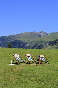 three white-and-green folding lounges thumbnail