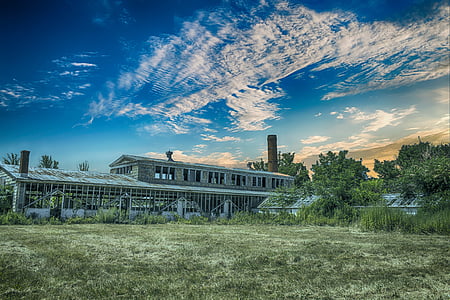 gray house under cloudy sky during daytime thumbnail