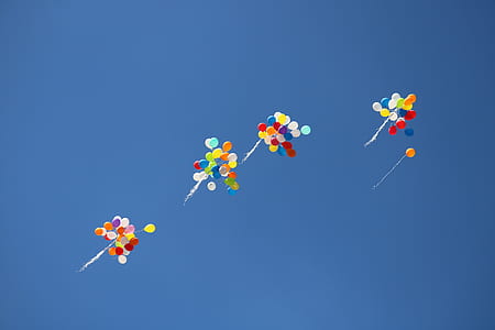 assorted-color balloon on sky thumbnail