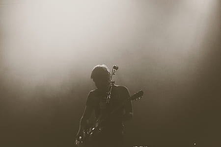 silhouette of man playing guitar thumbnail