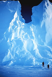 two person standing near glacier thumbnail