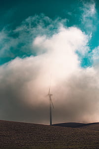 white windmill covered with clouds thumbnail