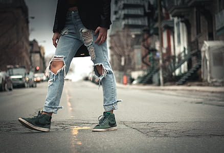 photo of person walking on pavement road thumbnail