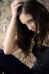 woman elbow on knee hand on scalp thumbnail