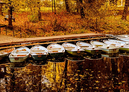gray Jon boats beside dock thumbnail