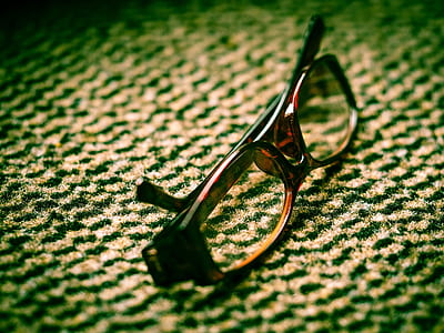 brown and black framed eyeglasses on area rug thumbnail