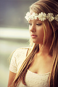 Pretty girl with crown of white flowers thumbnail