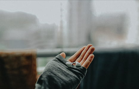 person holding earphones thumbnail