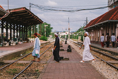 three mens walking in the rail thumbnail