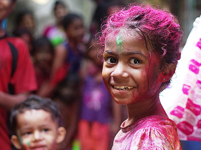 selective focus photo of girl in white shirt with pink ash on her hair thumbnail