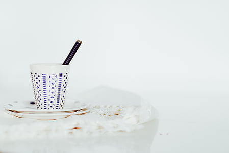 white and blue cup on white saucer thumbnail