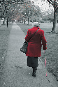 woman with cane walking on street thumbnail