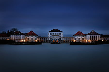 white painted house near body of water thumbnail