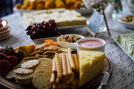 slice of yellow cheese and assorted breads on plate thumbnail