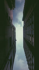 low angle photography of brown high rise buildings thumbnail