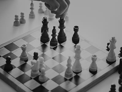 Grayscale Photo of Chess Board With Piece thumbnail