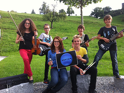 group of people holding musical instruments thumbnail