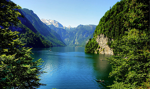body of water surround by mountains thumbnail