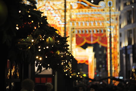 white string lights and green baubles during nighttime thumbnail