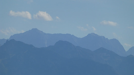 photo of mountains under blue sky thumbnail