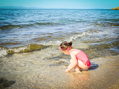 girl playing on seashore thumbnail