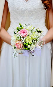 bride holding pink, white, and green roses bouquet thumbnail