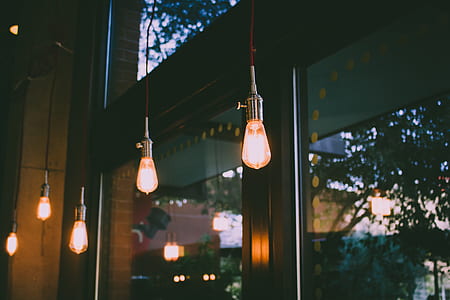 turn on pendant lamps beside glass window thumbnail