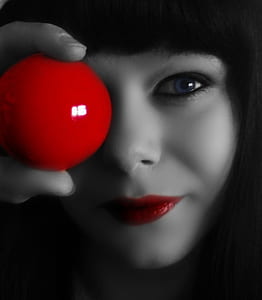 woman holding red ball thumbnail