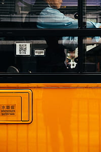 man sitting inside vehicle thumbnail
