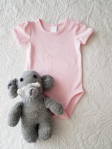 pink onesie and gray elephant plush toy thumbnail