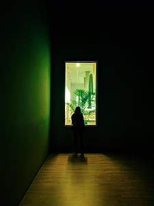 silhouette of person standing front of glass thumbnail