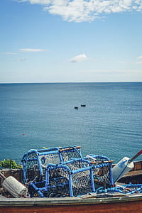 brown boat under blue sky thumbnail