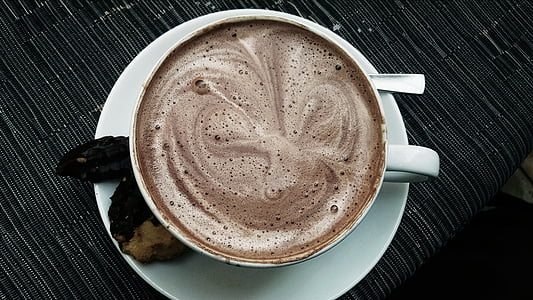 white ceramic mug with brown liquid thumbnail