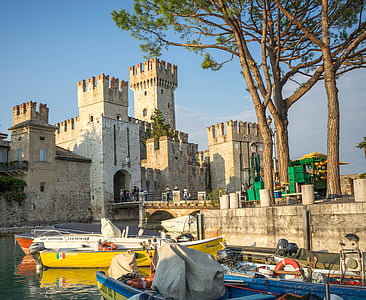 several assorted-color boats near castle thumbnail